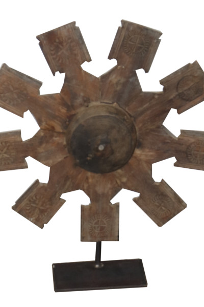 Old wheel pulley in wood on metal base. India