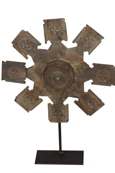 Old wheel pulley in wood on metal base. India